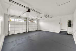 Garage featuring a garage door opener