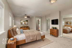 Bedroom with light carpet, ensuite bathroom, and baseboards