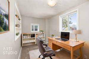 Office featuring baseboards and carpet