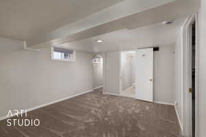Below grade area with carpet floors and baseboards