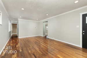 Unfurnished living room with baseboards, wood finished floors, and recessed lighting