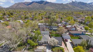 Birds eye view of property featuring a mountain view and a residential view