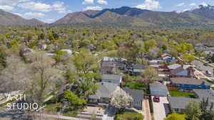 Birds eye view of property featuring a mountain view and a residential view