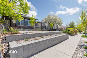 View of home's exterior with brick siding and fence
