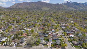 Birds eye view of property with a residential view and a mountain view