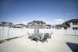 View of patio / terrace with a fenced backyard and a residential view