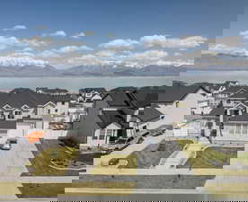 Aerial view featuring a residential view and a water and mountain view