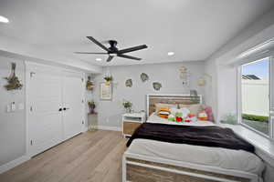 Bedroom featuring recessed lighting, light wood-type flooring, baseboards, and ceiling fan