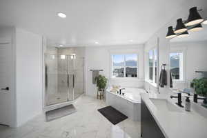 Full bath with a marble finish shower, recessed lighting, marble finish floor, a garden tub, and vanity