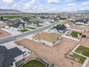 Birds eye view of property with a mountain view and a residential view