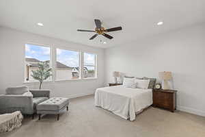 Carpeted bedroom with baseboards and recessed lighting