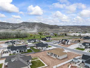 Drone / aerial view featuring a mountain view and a residential view