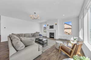Living area featuring a fireplace and large windows to provide plenty of natural light and views!