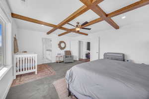 Master Bedroom w/ custom beamed ceiling, large windows & commanding lake & mountain view.