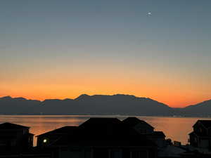 Sunrise view of mountain & lake.