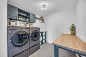 Laundry room with custom built in cabinets & folding space.