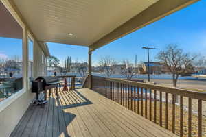 Deck with grilling area and a residential view