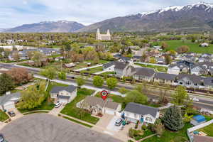 Birds eye view of property with a mountain view and a residential view