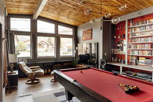 Playroom featuring wood ceiling, visible vents, built in shelves, and pool table