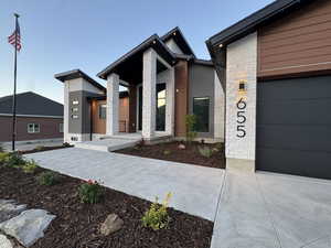 Modern home featuring stone siding