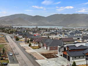 View of mountain feature featuring a water view and a residential view