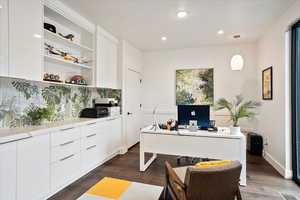 Home office with recessed lighting and dark wood finished floors