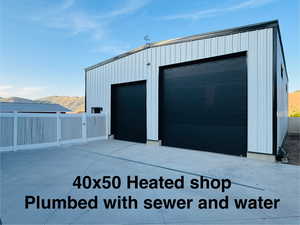 Detached garage featuring a mountain view.