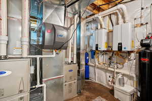 Utility room featuring water heater