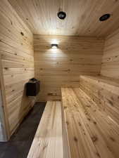 Sauna with wooden ceiling and wood walls