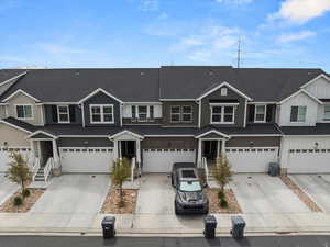 Multi unit property with concrete driveway and a garage