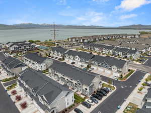 Birds eye view of property featuring a residential view and a water and mountain view