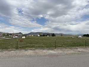 View of yard featuring a mountain view and a rural view