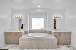 Primary Bathroom with soaker tub, and separate vanities