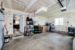 Garage featuring a garage door opener