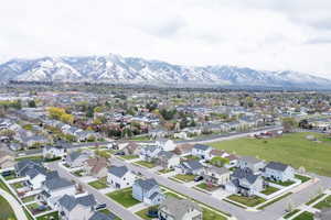 Birds eye view of property with a residential view and a mountain view