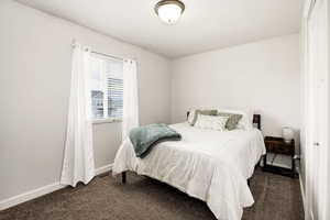 Carpeted bedroom with baseboards