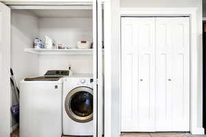 Laundry area with washing machine and dryer and laundry area