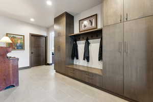 Mudroom featuring recessed lighting, baseboards, and light tile patterned floors