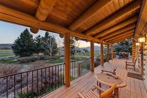 Wooden terrace featuring a mountain view
