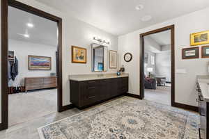Full bathroom featuring baseboards and vanity