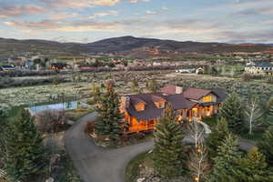 Aerial view at dusk featuring a mountain view