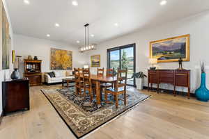 Dining room featuring light wood finished floors and recessed lighting