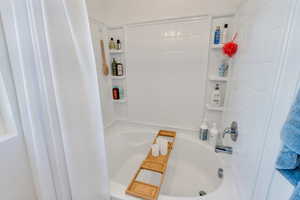 Full bath featuring shower / bath combo