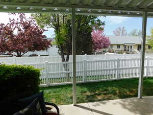 View of patio with fence