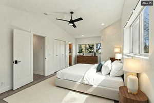 Bedroom with lofted ceiling, wood finished floors, a closet, recessed lighting, and a ceiling fan