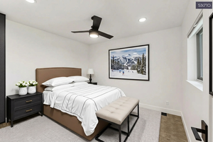 Bedroom with a ceiling fan, light carpet, and recessed lighting