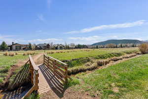 View of community with a rural view and a mountain view