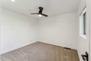 Carpeted empty room featuring recessed lighting, visible vents, a ceiling fan, and baseboards