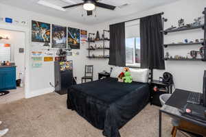 Bedroom with light colored carpet, ceiling fan