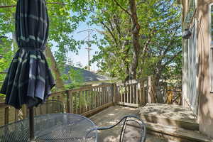 Wooden deck featuring outdoor dining area